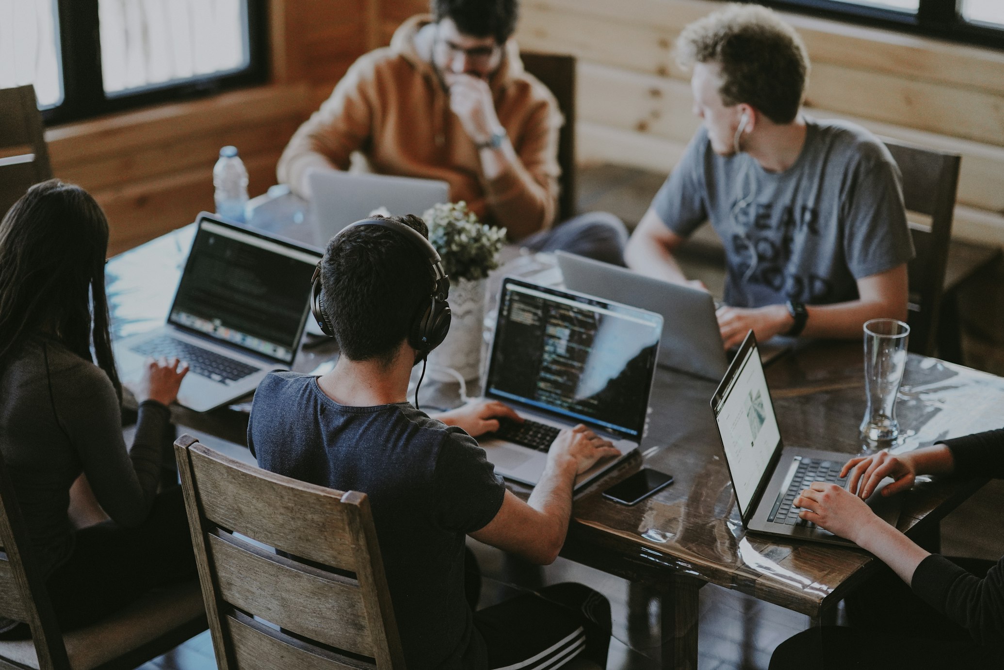 Professional team collaborating with AI assistance
